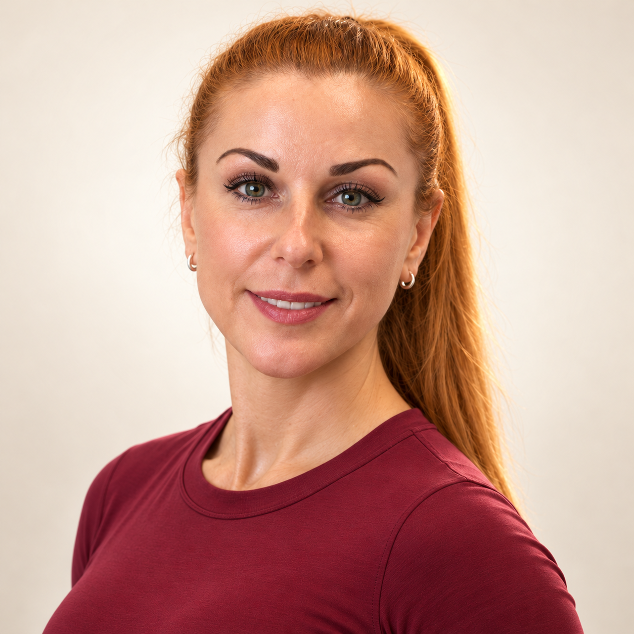 Mila Foxley wearing a burgundy training top